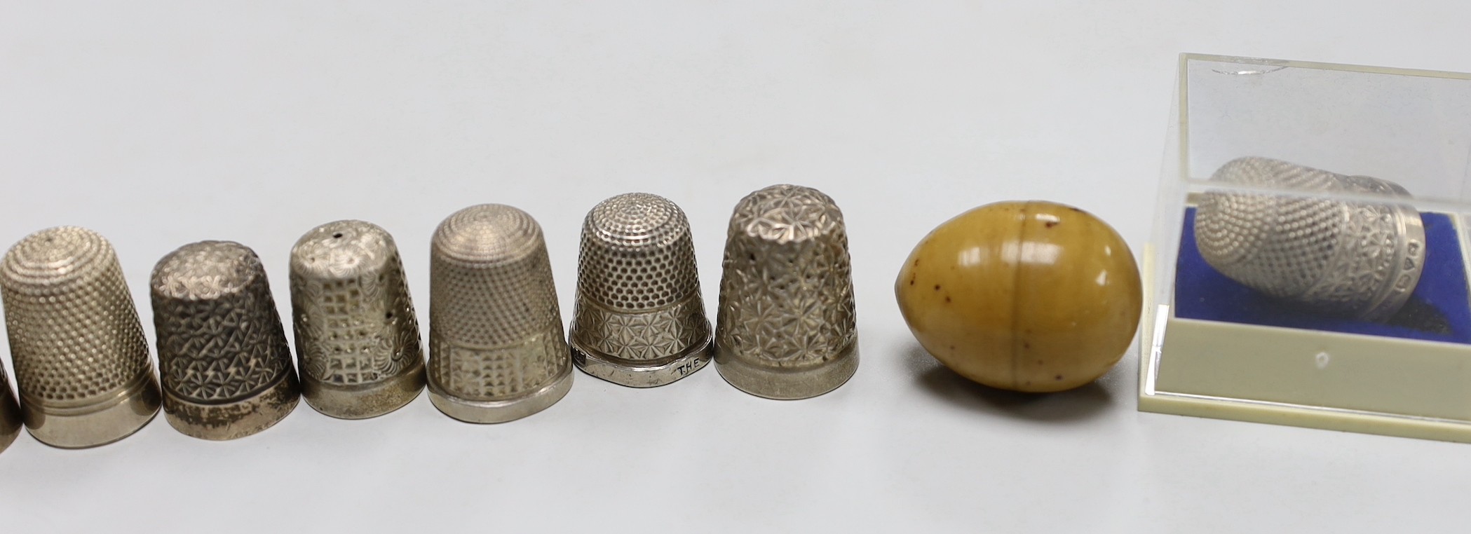 Eight assorted silver thimbles, including one in fitted leather case and two other items, etc.